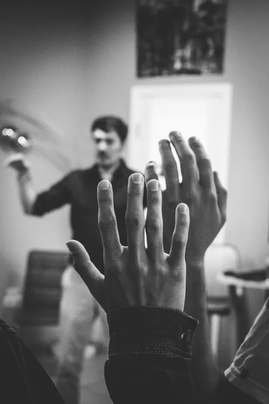 FAQ - Person raising hand asking questions